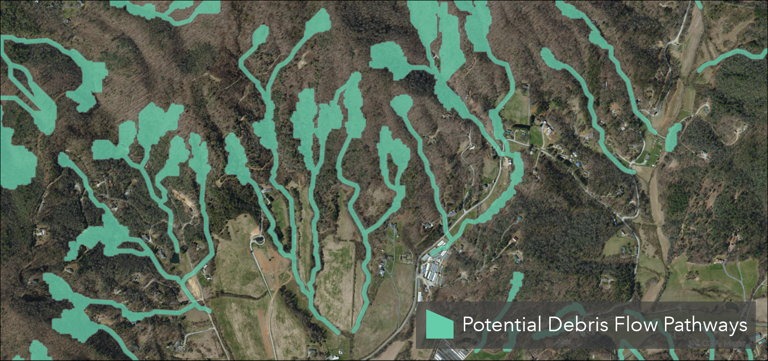 Static map showing potential debris flow pathway polygons in western North Carolina mountain drainages in green, delineating areas likely to be in the path of potential slope movements based on historical patterns